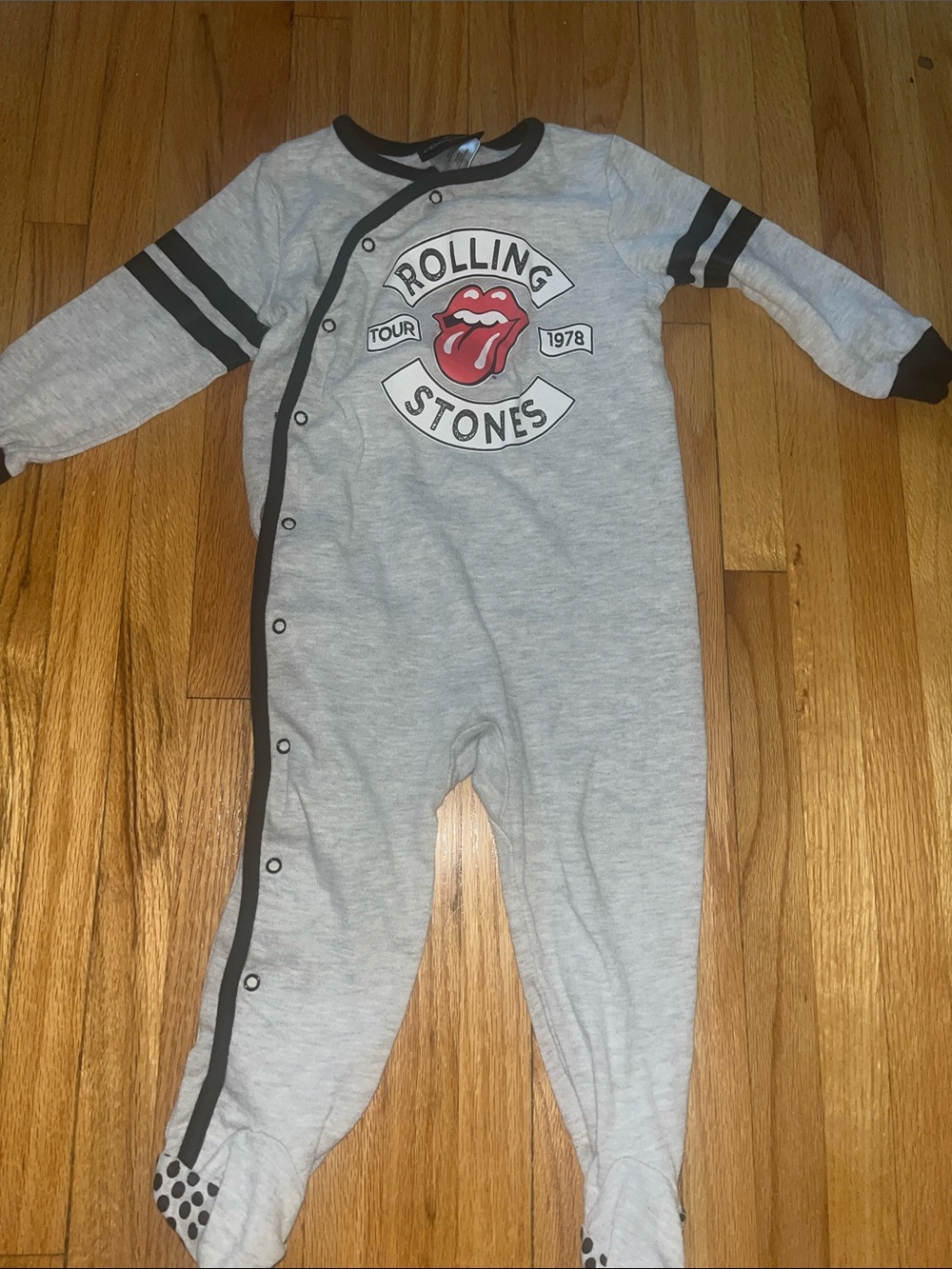 the Rolling Stones Gray and Black Logo Footed One-Piece